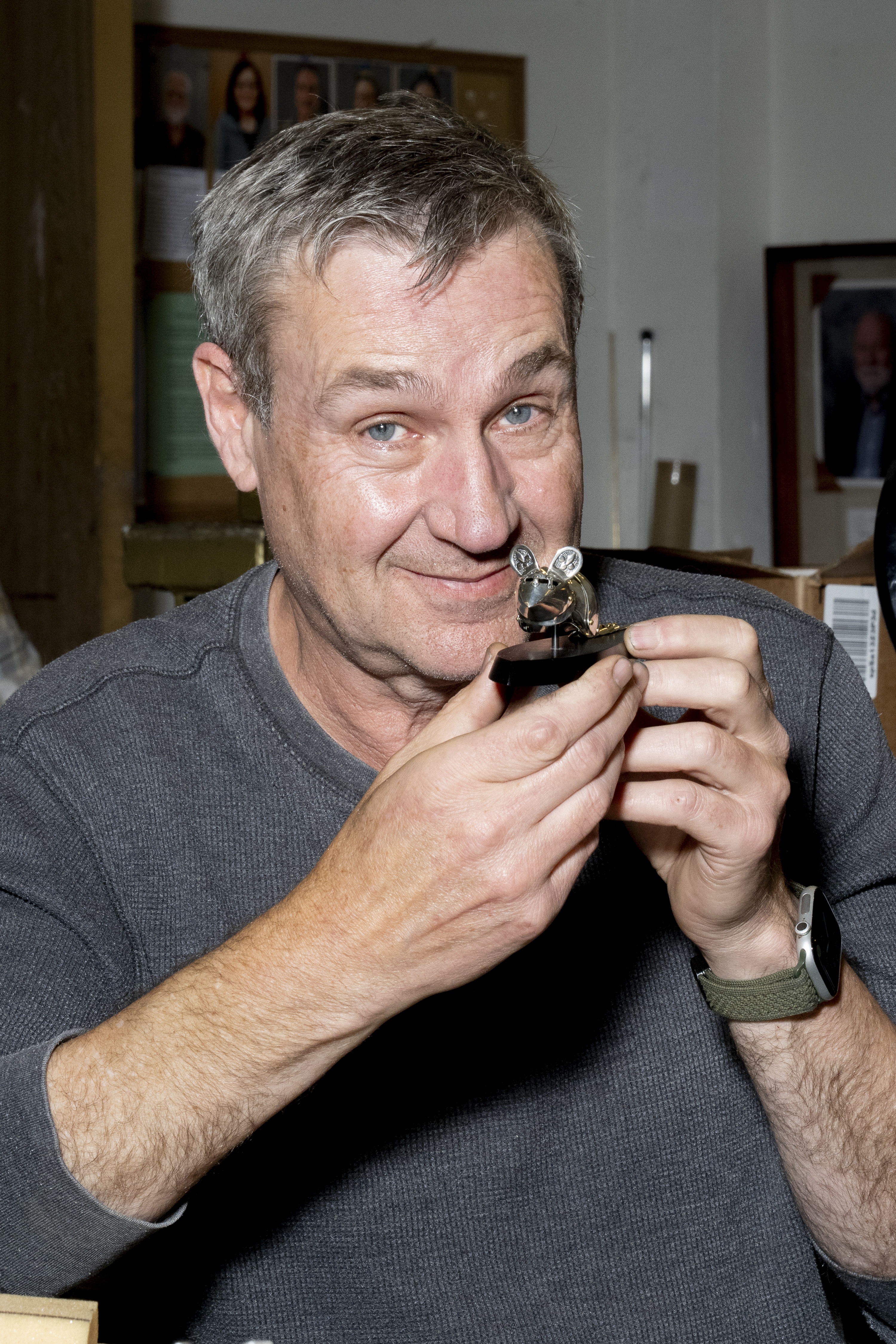 Jeff de Boer poses with one of his mouse armor pieces at a workshop at Pratt Fine Arts Center in Seattle, Wash., on Oct. 9.
